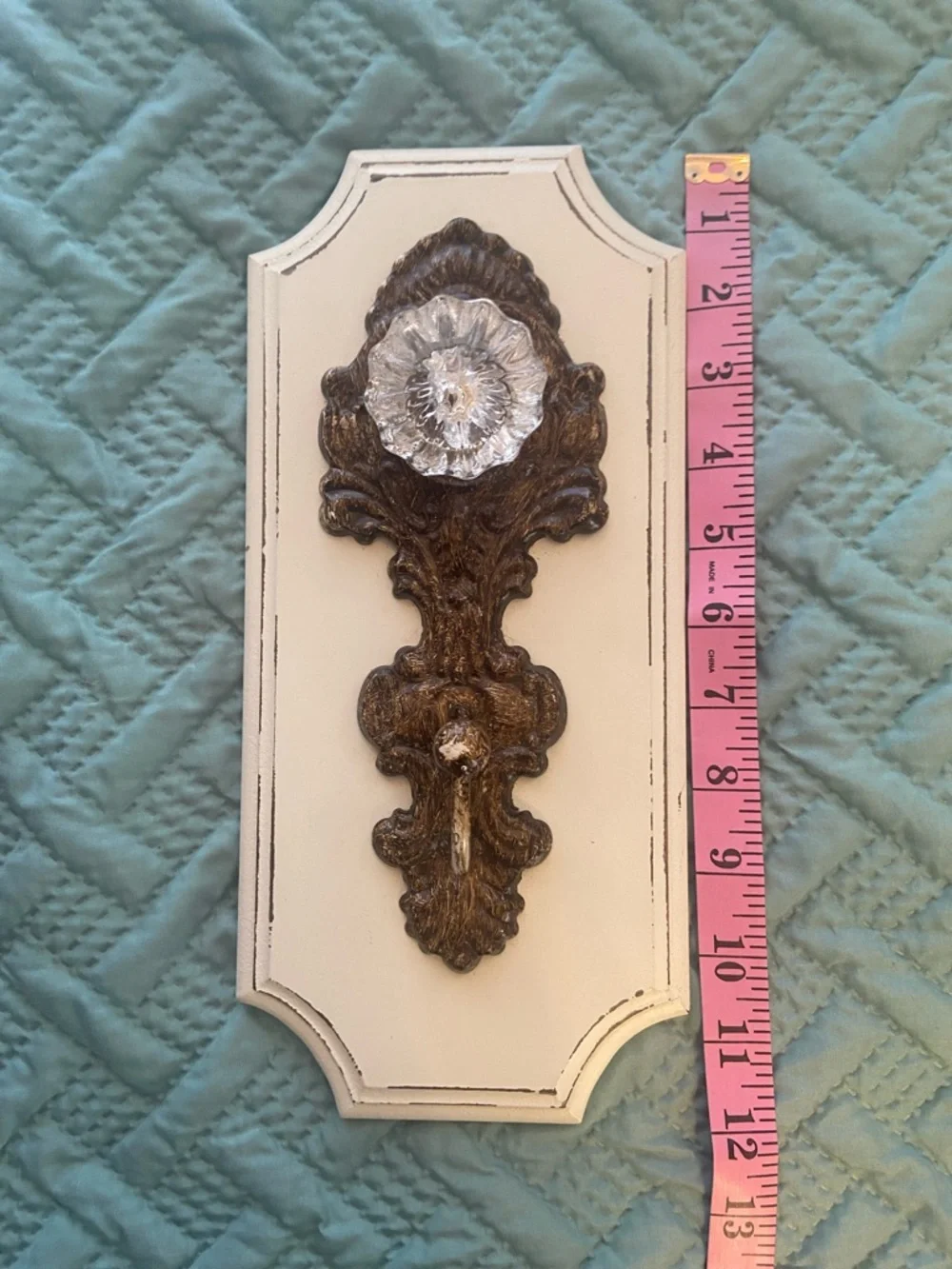 Decorative Cream Wall Hook with Vintage Bronze Colored Accent and Acrylic Knob